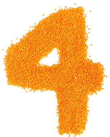 numbers of yellow lentils on a white backgroundの写真素材