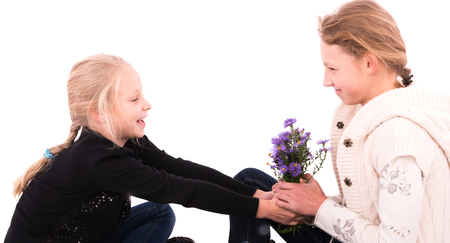 2 teen girls on a white backgroundの写真素材
