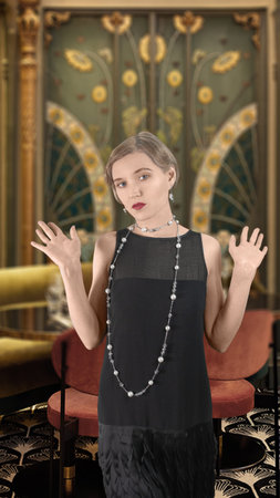 Retro photography, 1920 style. Girl in a black dress, hair waves. The background is out of focus.