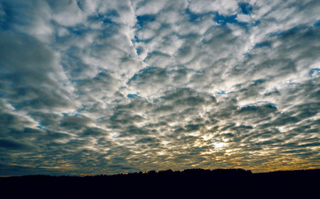 Cumulus clouds high in the azure sky, white clouds against a blue sky background close-up, beautiful...