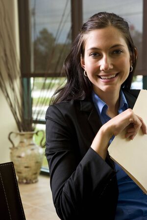 Portrait of young confident office worker smilingの写真素材
