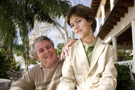 Portrait of grinning father and son outdoorsの写真素材