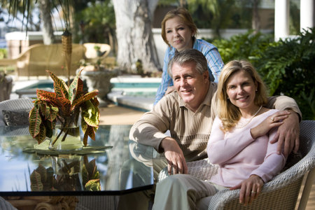 Portrait of family relaxing on patio together