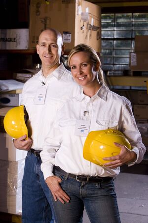 Two co-workers in office storage warehouseの写真素材