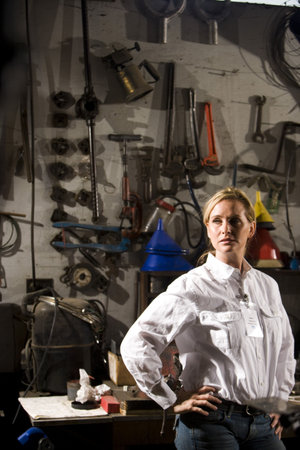 Woman standing in maintenance roomの写真素材