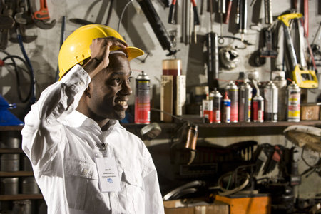 Young man in repair shop