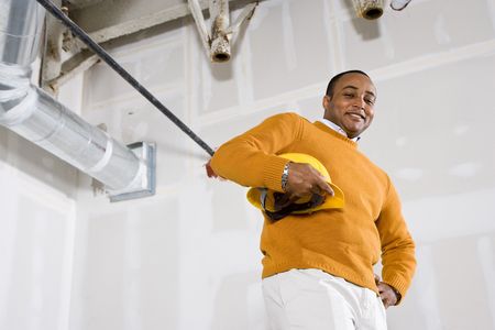 African American man in empty commercial office space ready for buildoutの写真素材
