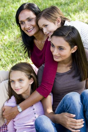 Interracial family portrait, Indian mother with three mixed-race childrenの写真素材