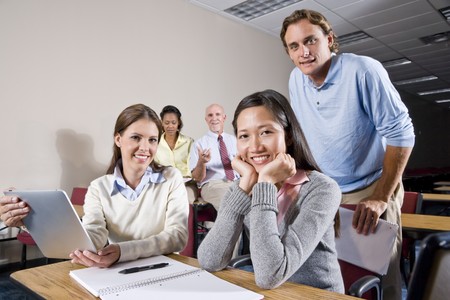 Multiracial group of college students and teacher in classの写真素材