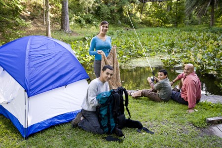 Hispanic family with two boys campingの写真素材