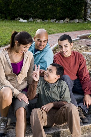 Portrait of Hispanic family with two boys outdoorsの写真素材