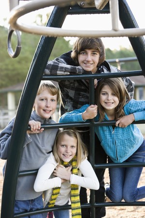 Group of children (10 to 15 years) posing together on playgroundの写真素材