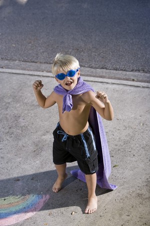 Cute boy, 7 years, in pretend superhero costumeの写真素材