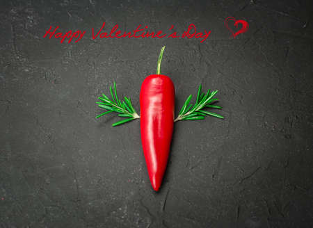 Hot red chili pepper on black background Valentine backgroundの写真素材