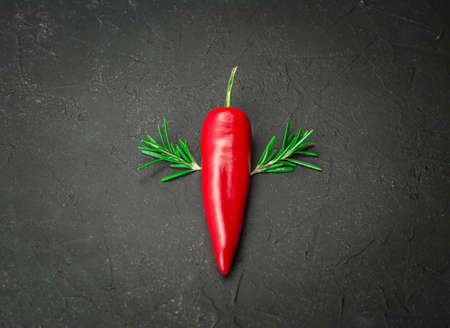 red hot chili  with herbs on blackの写真素材