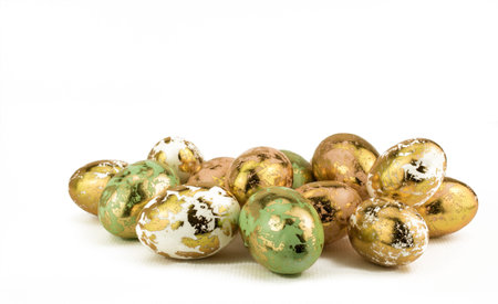gold easter eggs on wite backgrounds