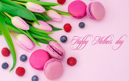 Tulip flowers with macaroons biscuits and textの写真素材