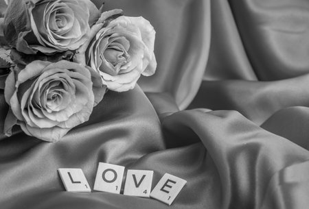 white and black  flowers on black and LOVE