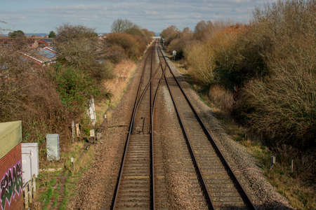 Railway tracks passes through the British  villagesの写真素材