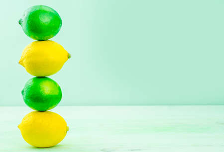 lenon and lime on green backgroundの写真素材