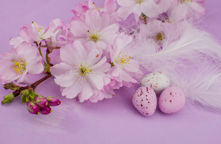 easter background chocolate easter eggs with pink flowers