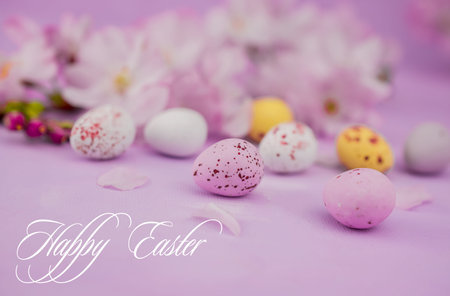 easter background chocolate easter eggs with pink flowers