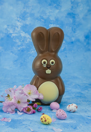 easter background chocolate easter eggs with pink flowers