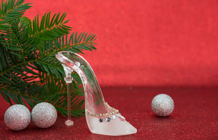 Shoe made of glass on the red backgroundの写真素材