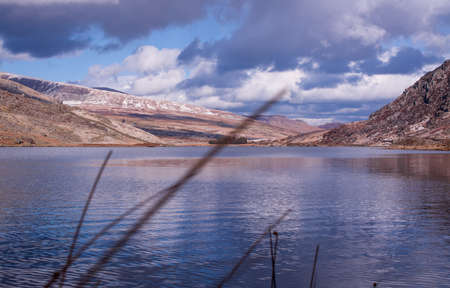 A moody landscape of the lakes Snowdonia National Park in Wales, UKの写真素材