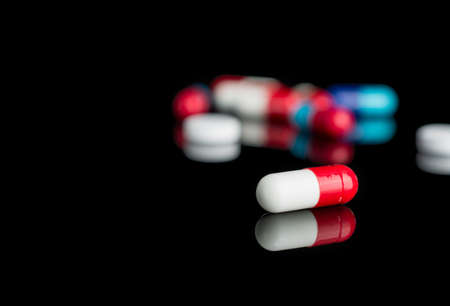 tablets capsules on a black backgroundの写真素材