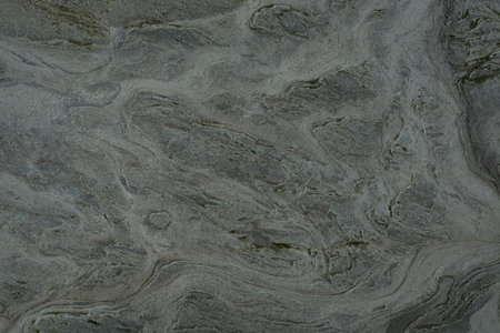 Stone abstract natural background of rock with strange texture on the beach