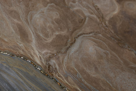 Stone abstract natural background of rock with strange texture on the beach