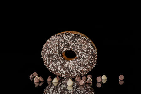 image of a doughnut  on a black backgroundの写真素材