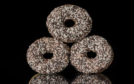 image of a doughnut  on a black backgroundの写真素材