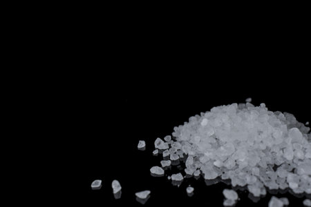 Himalayan pink salt on black background