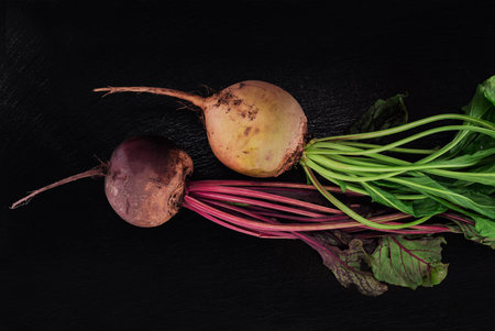 Beetroot on dark stone table. Top view. Vegetarian food concept.