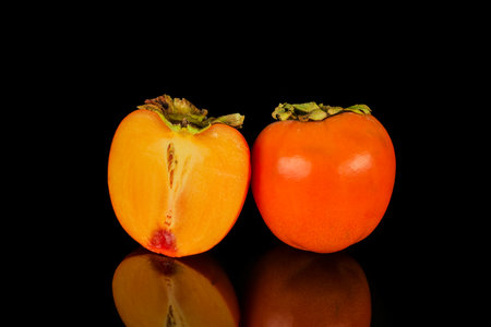 A kaki fruit on black backgroundの写真素材
