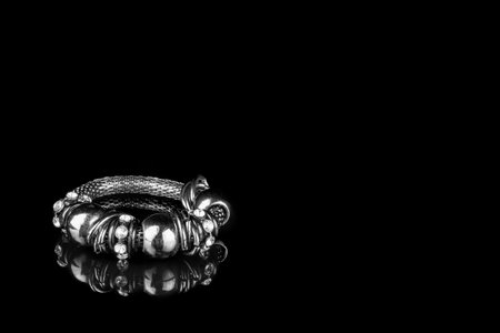 abstract black bracelet on dark background textureの写真素材