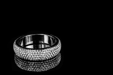 abstract black bracelet on dark background textureの写真素材