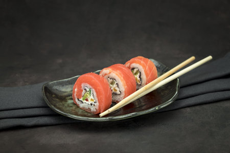 A set of delicious sushi on dark background