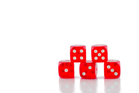 photo of red casino dice on white backgroundの写真素材