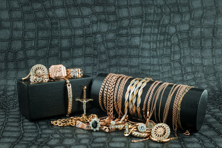 Old and broken scrap gold metal jewellery on  backgroundの写真素材