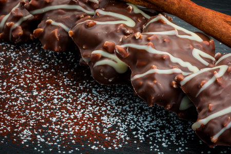 Chocolate cookies with nuts and cinnamon on a dark background. Toned.の写真素材