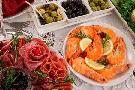 Antipasto with prawns, olives, jamon and rosemaryの写真素材