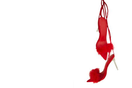 Red women's shoes on a white background with copy space for textの写真素材