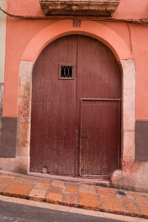 Old wooden door in the old town of Cartagena, Colombiaの写真素材