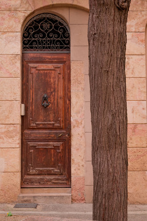 Old wooden door in the old town of Barcelona, Spain. Architectural details.の写真素材