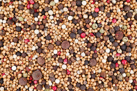 Peppercorn background. Close up of mixed peppercorns.