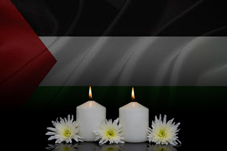 Burning candles on the flag background.の写真素材
