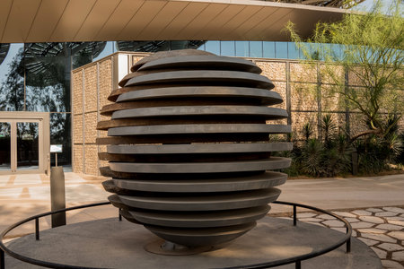 A close up view of a modern sculpture in a public park.
